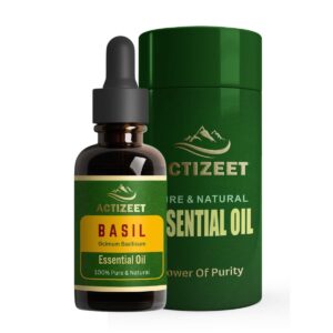a bottle of Basil oil next to a green container